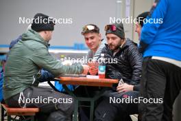 22.02.2024, Oberstdorf, Germany (GER): feature: staff playing cards while waiting - FIS world cup ski jumping men, training, Oberstdorf (GER). www.nordicfocus.com. © Reichert/NordicFocus. Every downloaded picture is fee-liable