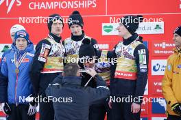 26.01.2024, Bad Mitterndorf, Germany (GER): Lovro Kos (SLO), Peter Prevc (SLO), Domen Prevc (SLO), Timi Zajc (SLO), (l-r) - FIS world championships ski flying men, medals, Bad Mitterndorf (GER). www.nordicfocus.com. © Thibaut/NordicFocus. Every downloaded picture is fee-liable.