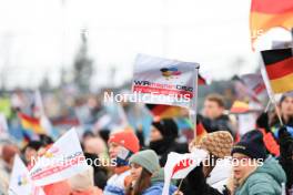 01.01.2024, Oberstdorf, Germany (GER): Feature: Fans with flags „Wir machen Druck“ - FIS world cup ski jumping women, individual HS137, Oberstdorf (GER). www.nordicfocus.com. © Manzoni/NordicFocus. Every downloaded picture is fee-liable