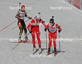 Biathlon - IBU Biathlon World Championchips 2007 relay men 4x7,5 km, 10.02.2007 - Antholz/Anterselva (ITA): Lars Berger (NOR) hands to Ole Einar Bjoerndalen (NOR)