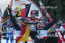 Cross-Country - FIS World Cup Cross Country  - Tour de Ski - Final Climb Pursuit - Handicap-Start - Free Technique - Val di Fiemme (ITA) - Jan 7, 2007: German team celebrating Tobias Angerer, left to right: Franz Goering (GER), Tobias Angerer (GER), Jens Filbrich (GER)