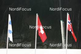 Ski Jumping - FIS Nordic World Ski Championchips ski jumping, individual large hill HS 134 - Sapporo (JPN): Flags for Harri Olli (FIN), Simon Ammann (SUI), Roar Ljoekelsoey (NOR).