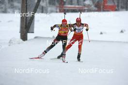 29.11.2007, Kontiolahti, Finland (FIN): Andrea Henkel (GER) and Chunli Wang (CHN) - IBU world cup biathlon, individual women, Kontiolahti (FIN). www.nordicfocus.com. c Manzoni/NordicFocus. Every downloaded picture is fee-liable.