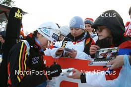 29.11.2007, Kontiolahti, Finland (FIN): Kathrin Hitzer (GER) signing autograph cards - IBU world cup biathlon, individual women, Kontiolahti (FIN). www.nordicfocus.com. c Manzoni/NordicFocus. Every downloaded picture is fee-liable.