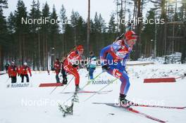 02.12.2007, Kontiolahti, Finland (FIN): Olga Anisimova (RUS) and Ann Kristin Flatland (NOR) - IBU world cup biathlon, pursuit women, Kontiolahti (FIN). www.nordicfocus.com. c Manzoni/NordicFocus. Every downloaded picture is fee-liable.