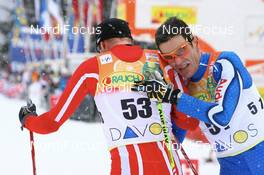 08.12.2007, Davos (SUI): Odd-Bjoern Hjelmeset (NOR) and Pietro Piller Cottrer (ITA) - FIS World Cup cross-country, 15km men - Davos (SUI). www.nordicfocus.com. c Manzoni/NordicFocus. Every downloaded picture is fee-liable.