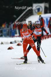 06.01.2008, Oberhof, Germany (GER): Tora Berger (NOR) leads Delphine Peretto (FRA) - IBU World Cup biathlon, mass women - Oberhof (GER). www.nordicfocus.com. c Manzoni/NordicFocus. Every downloaded picture is fee-liable.