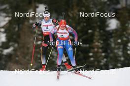 19.01.2008, Antholz, Italy (ITA): Ekaterina Iourieva (RUS) and Kathrin Hitzer (GER) - IBU World Cup biathlon, pursuit women - Antholz (ITA). www.nordicfocus.com. c Manzoni/NordicFocus. Every downloaded picture is fee-liable.