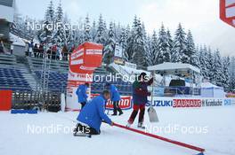 18.01.2008, Antholz, Italy (ITA): volunteers prepare the finish line - IBU World Cup biathlon, training - Antholz (ITA). www.nordicfocus.com. c Manzoni/NordicFocus. Every downloaded picture is fee-liable.