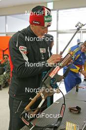 02.03.2008, Pyeong Chang, Korea (KOR): feature: Friedrich Pinter (AUT) cleaning his rifle - IBU World Cup biathlon, mixed relay - Pyeong Chang (KOR). www.nordicfocus.com. c Hemmersbach/NordicFocus. Every downloaded picture is fee-liable.