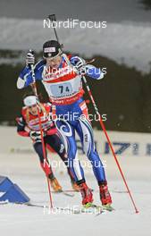 02.03.2008, Pyeong Chang, Korea (KOR): Christian de Lorenzi (ITA), behind Alexis Boeuf (FRA) - IBU World Cup biathlon, mixed relay - Pyeong Chang (KOR). www.nordicfocus.com. c Hemmersbach/NordicFocus. Every downloaded picture is fee-liable.