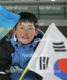 28.02.2008, Pyeong Chang, Korea (KOR): Feature, Korean boy with flag - IBU World Cup biathlon, sprint women - Pyeong Chang (KOR). www.nordicfocus.com. c Hemmersbach/NordicFocus. Every downloaded picture is fee-liable.