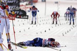05.01.08, Val di Fiemme, Italy (ITA): Olga Rotcheva (RUS) lying behind the finish line - FIS world cup cross-country, tour de ski, mass women, Val di Fiemme (ITA). www.nordicfocus.com. c Felgenhauer/NordicFocus. Every downloaded picture is fee-liable.
