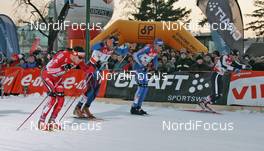 29.12.2008, Prag, Czech Republic (CZE): group, l-r: Dario Cologna (SUI), Fischer, Rottefella, Alpina, Swix, adidas, Roddy Darragon (FRA), Rossignol, Rottefella, Odlo, Vasili Rotchev (RUS), Fischer, Salomon, Swix, adidas, Girogio di Centa (ITA), Atomic, Swix, Rudy Project  - FIS world cup cross-country, tour de ski, individual sprint, Prag (CZE). www.nordicfocus.com. © Hemmersbach/NordicFocus. Every downloaded picture is fee-liable.
