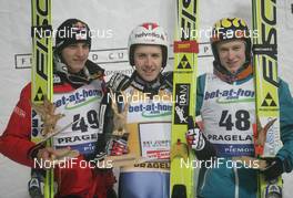 13.12.2008, Pragelato, Italy (ITA): l-r: Gregor Schlierenzauer (AUT), Simon Ammann (SUI), Ville Larinto (FIN) Fischer, adidas, Gregor Schlierenzauer (AUT), Fischer  - FIS world cup ski jumping, individual HS140, Pragelato (ITA). www.nordicfocus.com. © Domanski/NordicFocus. Every downloaded picture is fee-liable.