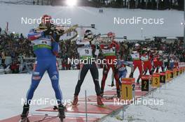 11.01.2009, Oberhof, Germany (GER): Dmitri Iarochenko (RUS), Madshus, Rottefella, Swix, adidas, Christian de Lorenzi (ITA), Fischer, Rottefella, Alpina, Leki, Emil Hegle Svendsen (NOR), Madshus, Rottefella, Swix, Odlo, - IBU world cup biathlon, mass men, Oberhof (GER). www.nordicfocus.com. © Manzoni/NordicFocus. Every downloaded picture is fee-liable.