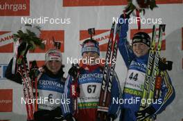 09.01.2009, Oberhof, Germany (GER): l-r: Andrea Henkel (GER), Atomic, Exel, adidas, Toko, Ekaterina Iourieva (RUS), Madshus, Rottefella, Swix, adidas, Helena Jonsson (SWE), Fischer, Rottefella, Leki, adidas - IBU world cup biathlon, sprint women, Oberhof (GER). www.nordicfocus.com. © Manzoni/NordicFocus. Every downloaded picture is fee-liable.