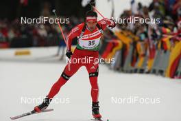 18.01.2009, Ruhpolding, Germany (GER): Simon Hallenbarter (SUI), Madshus, Rottefella, KV+, adidas - IBU world cup biathlon, pursuit men, Ruhpolding (GER). www.nordicfocus.com. © Manzoni/NordicFocus. Every downloaded picture is fee-liable.