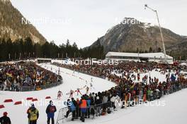 18.01.2009, Ruhpolding, Germany (GER): Zina Kocher (CAN), Atomic, Leki, Odlo leads a group through the crowd - IBU world cup biathlon, pursuit women, Ruhpolding (GER). www.nordicfocus.com. © Manzoni/NordicFocus. Every downloaded picture is fee-liable.