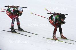 14.03.2009, Vancouver, Canada (CAN): In-Hee Jo (KOR) leads Megan Imrie (CAN), Salomon, Leki - IBU world cup biathlon, relay women, Vancouver (CAN). www.nordicfocus.com. © Manzoni/NordicFocus. Every downloaded picture is fee-liable.
