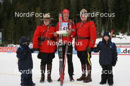 13.03.2009, Vancouver, Canada (CAN): Lars Berger (NOR), Madshus, Rottefella, Odlo with Mounties - IBU world cup biathlon, sprint men, Vancouver (CAN). www.nordicfocus.com. © Manzoni/NordicFocus. Every downloaded picture is fee-liable.
