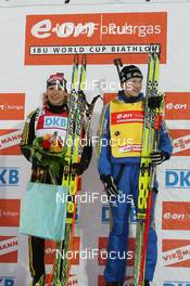 28.03.2009, Khanty-Mansiysk, Russia (RUS): Magdalena Neuner (GER), Fischer, Rottefella, Exel, adidas and Helena Jonsson (SWE), Fischer, Rottefella, Leki, adidas - IBU world cup biathlon, pursuit women, Khanty-Mansiysk (RUS). www.nordicfocus.com. © Manzoni/NordicFocus. Every downloaded picture is fee-liable.