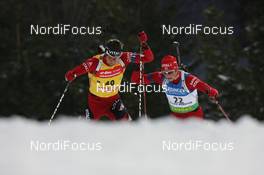 26.03.2009, Khanty-Mansiysk, Russia (RUS): Ole Einar Bjoerndalen (NOR), Madshus, Rottefella, Odlo and Alexander Os (NOR), Fischer, Rottefella, Swix, Odlo - IBU world cup biathlon, sprint men, Khanty-Mansiysk (RUS). www.nordicfocus.com. © Manzoni/NordicFocus. Every downloaded picture is fee-liable.