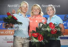 02.08.2009, Puettlingen, Germany: victory ceremony - Kaisa Maekaeraeinen (FIN), Atomic, Leki, Odlo, Tora Berger (NOR), Fischer, Rottefella, Odlo and Juliane Doell (GER), Fischer, Salomon, adidas  - Biathlon, 5. ODLO City Biathlon - Puettlingen (GER). www.nordicfocus.com. © Domanski/NordicFocus. Every downloaded picture is fee-liable.