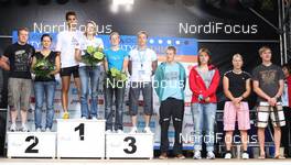02.08.2009, Puettlingen, Germany: Young Star - Teamchallenge - victory Ceremony - Martin Fourcade (FRA), Rossignol, Rottefella, Odlo and Marie Laure Brunet (FRA), Rossignol, Rottefella, Swix, Odlo  - Biathlon, 5. ODLO City Biathlon - Puettlingen (GER). www.nordicfocus.com. © Domanski/NordicFocus. Every downloaded picture is fee-liable.