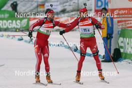 06.12.2009, Oestersund, Sweden (SWE): Claudio Boeckli (SUI), Rossignol, Rottefella, Leki, adidas  and Matthias Simmen (SUI), Rossignol, Rottefella, Exel, adidas - IBU world cup biathlon, relay men, Oestersund (SWE). www.nordicfocus.com. © Manzoni/NordicFocus. Every downloaded picture is fee-liable.