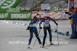 06.12.2009, Oestersund, Sweden (SWE): Marie Dorin (FRA), Rossignol, Rottefella, Exel, Odlo, Sandrine Bailly (FRA), Madshus, Rottefella, Swix, Odlo - IBU world cup biathlon, relay women, Oestersund (SWE). www.nordicfocus.com. © Manzoni/NordicFocus. Every downloaded picture is fee-liable.