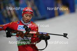 06.12.2009, Oestersund, Sweden (SWE): Yingchao Kong (CHN), Fischer, Salomon, Swix, adidas - IBU world cup biathlon, relay women, Oestersund (SWE). www.nordicfocus.com. © Manzoni/NordicFocus. Every downloaded picture is fee-liable.
