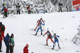12.12.2009, Hochfilzen, Austria (AUT): Biathlon Feature: Athletes climb a hill - IBU world cup biathlon, pursuit women, Hochfilzen (AUT). www.nordicfocus.com. © Manzoni/NordicFocus. Every downloaded picture is fee-liable.