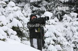 12.12.2009, Hochfilzen, Austria (AUT): Austrian Photographer in the woods - IBU world cup biathlon, pursuit women, Hochfilzen (AUT). www.nordicfocus.com. © Manzoni/NordicFocus. Every downloaded picture is fee-liable.