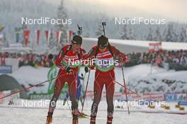 13.12.2009, Hochfilzen, Austria (AUT): Jaime Robb (CAN), Rossignol, Rottefella, Leki and Brendan Green (CAN), Madshus, Rottefella, Leki - IBU world cup biathlon, relay men, Hochfilzen (AUT). www.nordicfocus.com. © Manzoni/NordicFocus. Every downloaded picture is fee-liable.