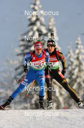 13.12.2009, Hochfilzen, Austria (AUT): Evgeny Ustyugov (RUS), Madshus, Rottefella, Swix, adidas leads Arnd Peiffer (GER), Fischer, Salomon, Swix, adidas - IBU world cup biathlon, relay men, Hochfilzen (AUT). www.nordicfocus.com. © Manzoni/NordicFocus. Every downloaded picture is fee-liable.
