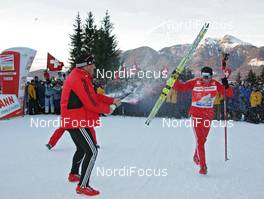 04.01.2009, Val di Fiemme, Italy (ITA): feature, l-r Markus Cramer (GER), headcoach cross-country team Swiss-Ski , Dario Cologna (SUI), Fischer, Rottefella, Alpina, Swix, adidas celebrating the victory, topshot - FIS world cup cross-country, tour de ski, final climb men, Val di Fiemme (ITA). www.nordicfocus.com. © Hemmersbach/NordicFocus. Every downloaded picture is fee-liable.