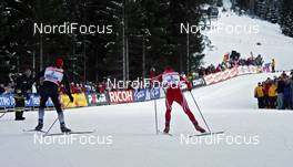 04.01.2009, Val di Fiemme, Italy (ITA): Petter Northug (NOR), Fischer, Rottefella, Alpina, Ski Go, Swix  overtaking Axel Teichmann (GER), Madshus, Rottefella, Swix, adidas, Toko  - FIS world cup cross-country, tour de ski, final climb men, Val di Fiemme (ITA). www.nordicfocus.com. © Felgenhauer/NordicFocus. Every downloaded picture is fee-liable.