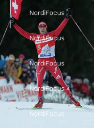 04.01.2009, Val di Fiemme, Italy (ITA): TdS overall winner, Dario Cologna (SUI), Fischer, Rottefella, Alpina, Swix, adidas  - FIS world cup cross-country, tour de ski, final climb men, Val di Fiemme (ITA). www.nordicfocus.com. © Hemmersbach/NordicFocus. Every downloaded picture is fee-liable.