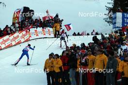 04.01.2009, Val di Fiemme, Italy (ITA): l-r:  Vasili Rotchev (RUS), Fischer, Salomon, Swix, adidas, Girogio di Centa (ITA), Atomic, Swix, Rudy Project on the last meters - FIS world cup cross-country, tour de ski, final climb men, Val di Fiemme (ITA). www.nordicfocus.com. © Felgenhauer/NordicFocus. Every downloaded picture is fee-liable.