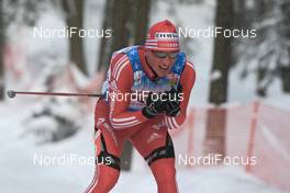 30.01.2009, Rybisnk, Russia (RUS): Reto Burgermeister (SUI), Fischer, Salomon, Swix, adidas  - FIS world cup cross-country, mass men, Rybinsk (RUS). www.nordicfocus.com. © Hemmersbach/NordicFocus. Every downloaded picture is fee-liable.