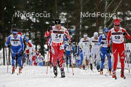 21.03.2009, Falun, Sweden (SWE): l-r:  Maxim Vylegzhanin (RUS), Fischer, Rottefella, Alpina, Swix, adidas, George Grey (CAN), Fischer, Thomas Diezig (SUI), Fischer, Rottefella, Alpina, Swix, adidas  - FIS world cup cross-country, pursuit men, Falun (SWE). www.nordicfocus.com. © Felgenhauer/NordicFocus. Every downloaded picture is fee-liable.
