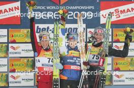 19.02.2009, Liberec, Czech Republic (CZE): Marianna Longa (ITA), Fischer, Salomon, One Way, Aino Kaisa Saarinen (FIN), Rossignol, Rottefella, One Way, Justyna Kowalczyk (POL), Fischer, Salomon, Swix  - FIS nordic world ski championships, cross-country, 10km women, Liberec (CZE). www.nordicfocus.com. © Domanski/NordicFocus. Every downloaded picture is fee-liable.