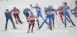 01.03.2009, Liberec, Czech Republic (CZE): group , in front Christian Hoffmann (AUT), Fischer, Rottefella, Alpina , behind Alexander Legkov (RUS), Madshus, Rottefella, Swix, adidas  - FIS nordic world ski championships, cross-country, mass men, Liberec (CZE). www.nordicfocus.com. © Domanski/NordicFocus. Every downloaded picture is fee-liable.