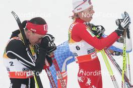 21.02.2009, Liberec, Czech Republic (CZE): l-r Justyna Kowalczyk (POL), Fischer, Salomon, Swix , Kristin Stoermer Steira (NOR), Madshus, Rottefella, One Way, Swix  - FIS nordic world ski championships, cross-country, pursuit women, Liberec (CZE). www.nordicfocus.com. © Domanski/NordicFocus. Every downloaded picture is fee-liable.