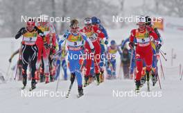 21.02.2009, Liberec, Czech Republic (CZE): Group, l-r Justyna Kowalczyk (POL), Fischer, Salomon, Swix, Marianna Longa (ITA), Fischer, Salomon, One Way, Marit Bjoergen (NOR), Fischer, Rottefella, Swix  - FIS nordic world ski championships, cross-country, pursuit women, Liberec (CZE). www.nordicfocus.com. © Hemmersbach/NordicFocus. Every downloaded picture is fee-liable.