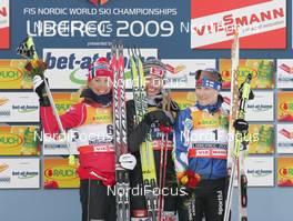 21.02.2009, Liberec, Czech Republic (CZE): podium , Kristin Stoermer Steira (NOR), Madshus, Rottefella, One Way, Swix , Justyna Kowalczyk (POL), Fischer, Salomon, Swix , Aino Kaisa Saarinen (FIN), Rossignol, Rottefella, One Way  - FIS nordic world ski championships, cross-country, pursuit women, Liberec (CZE). www.nordicfocus.com. © Domanski/NordicFocus. Every downloaded picture is fee-liable.