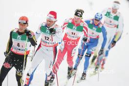 27.02.2009, Liberec, Czech Republic (CZE): group , l-r , Jens Filbrich (GER), Rossignol, Rottefella, One Way, adidas , Jaak Mae (EST), Fischer, Rottefella, Swix , Devon Kershaw (CAN), Fischer, Salomon, Swix  - FIS nordic world ski championships, cross-country, 4x10km men, Liberec (CZE). www.nordicfocus.com. © Domanski/NordicFocus. Every downloaded picture is fee-liable.