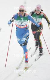 26.02.2009, Liberec, Czech Republic (CZE): group , in front Olga Rotcheva (RUS), Fischer, Rottefella, Rossignol, Swix, adidas , behind Evi Sachenbacher Stehle (GER), Madshus, Rottefella, Leki, adidas  - FIS nordic world ski championships, cross-country, 4x5km women, Liberec (CZE). www.nordicfocus.com. © Domanski/NordicFocus. Every downloaded picture is fee-liable.