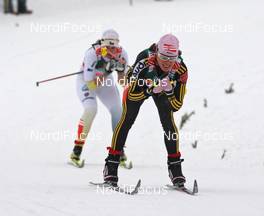 26.02.2009, Liberec, Czech Republic (CZE): Evi Sachenbacher Stehle (GER), Madshus, Rottefella, Leki, adidas, behind Britta Norgren (SWE), Fischer, Rottefella, Swix, Craft  - FIS nordic world ski championships, cross-country, 4x5km women, Liberec (CZE). www.nordicfocus.com. © Hemmersbach/NordicFocus. Every downloaded picture is fee-liable.
